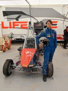 Standing next to the FIA Rally Star Cross Kart